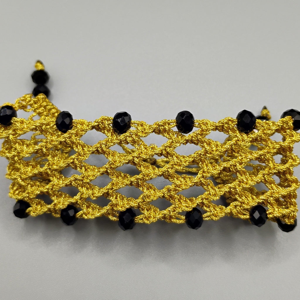 PULSERA REJILLA DORADA