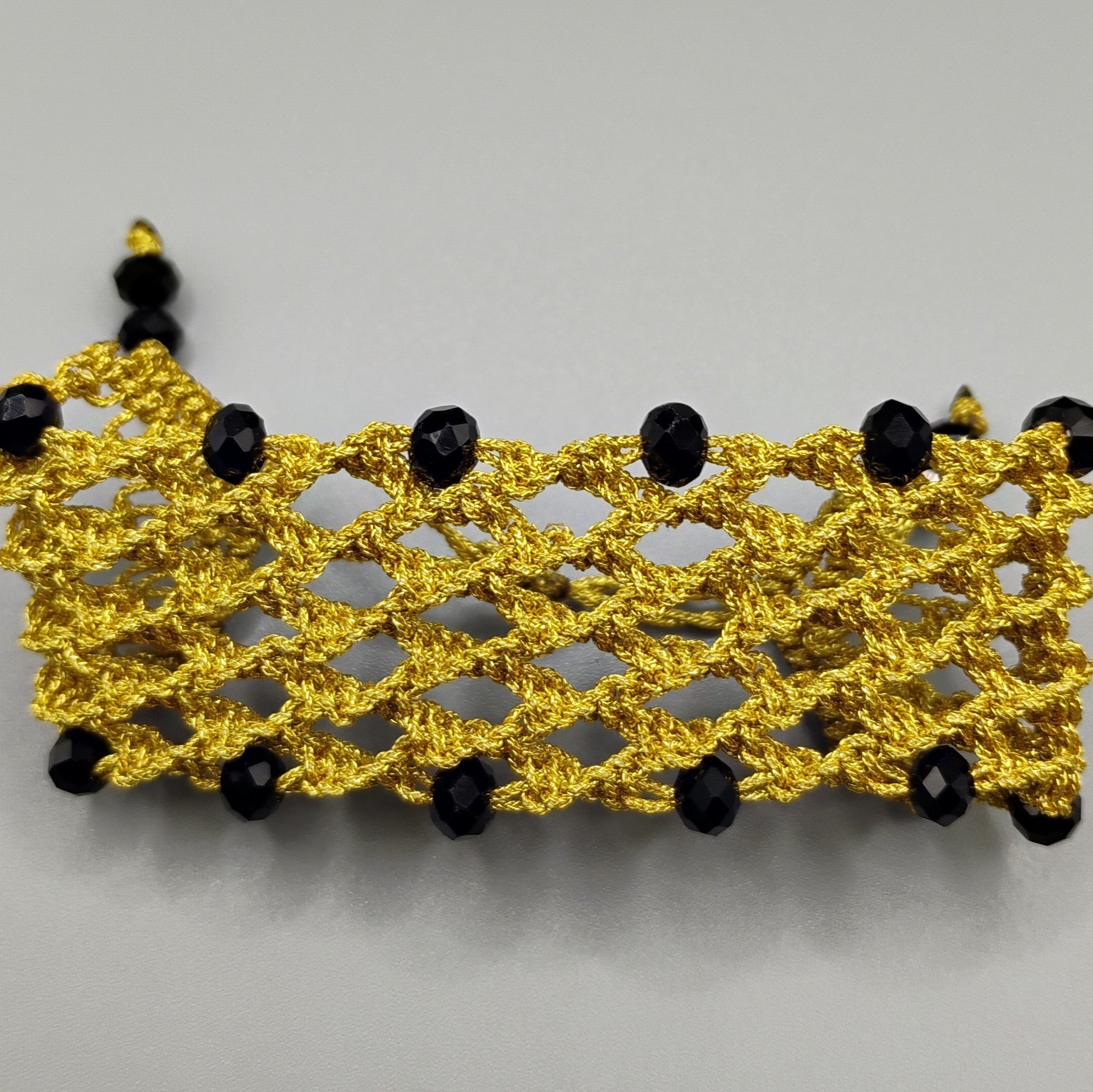 PULSERA REJILLA DORADA