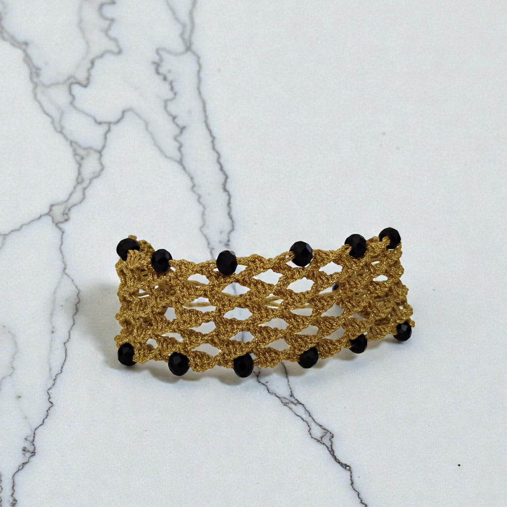 PULSERA REJILLA DORADA