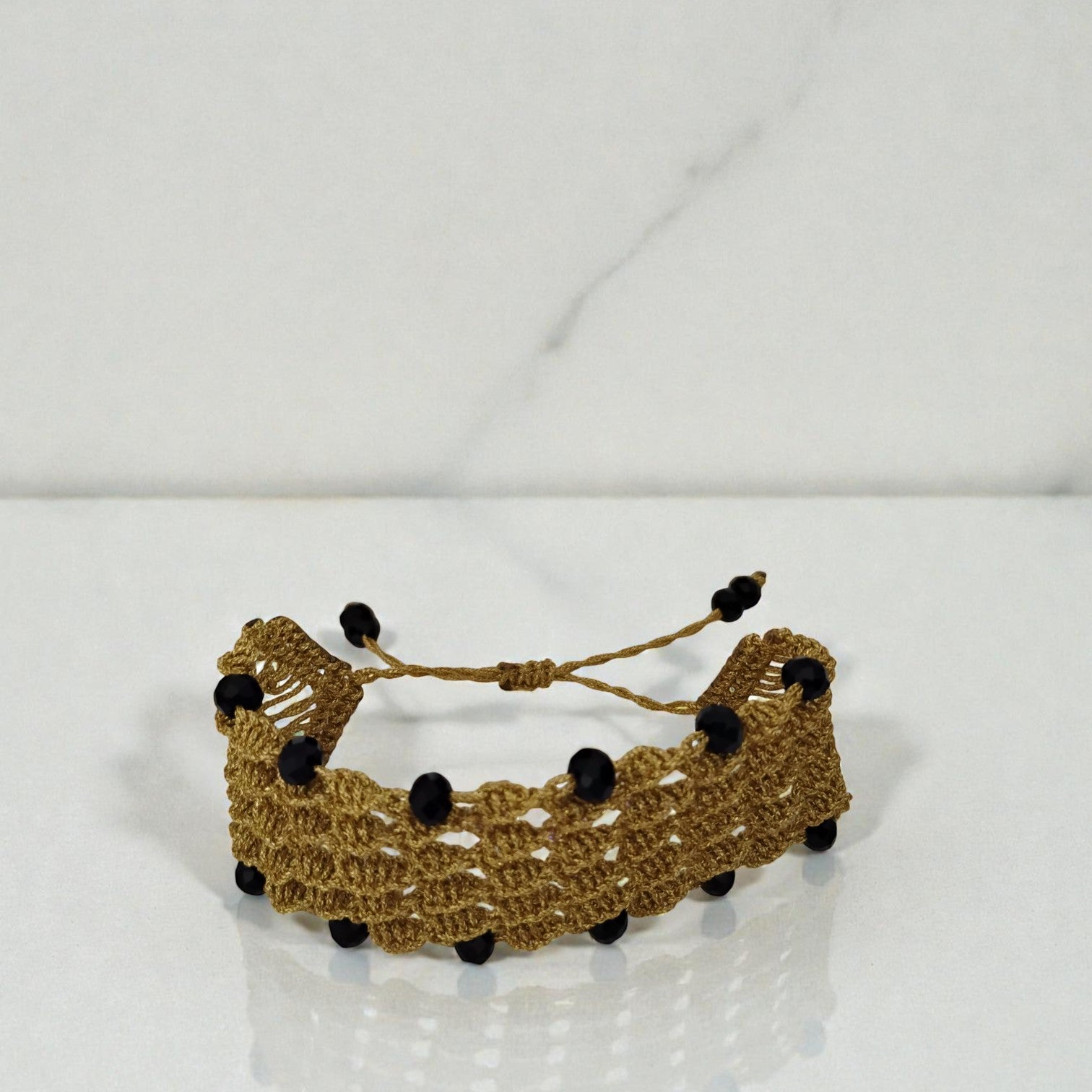 PULSERA REJILLA DORADA