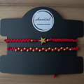 CONJUNTO DE DOS PULSERAS ROJAS CON ESTRELLA