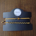 CONJUNTO DE DOS PULSERAS DORADAS CON ESTRELLA