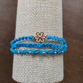 PULSERA TRIPLE AZUL CON FLOR