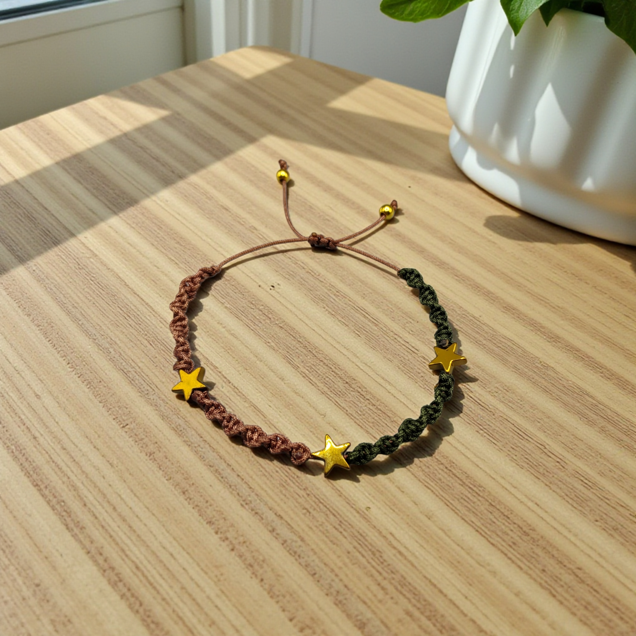 CONJUNTO DE DOS PULSERAS CON ESTRELLA EN HILO DE DOS COLORES